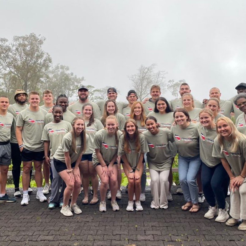 The Athletes in Action mission trip team, Marques Watson Trent among them, gathered on a misty morning