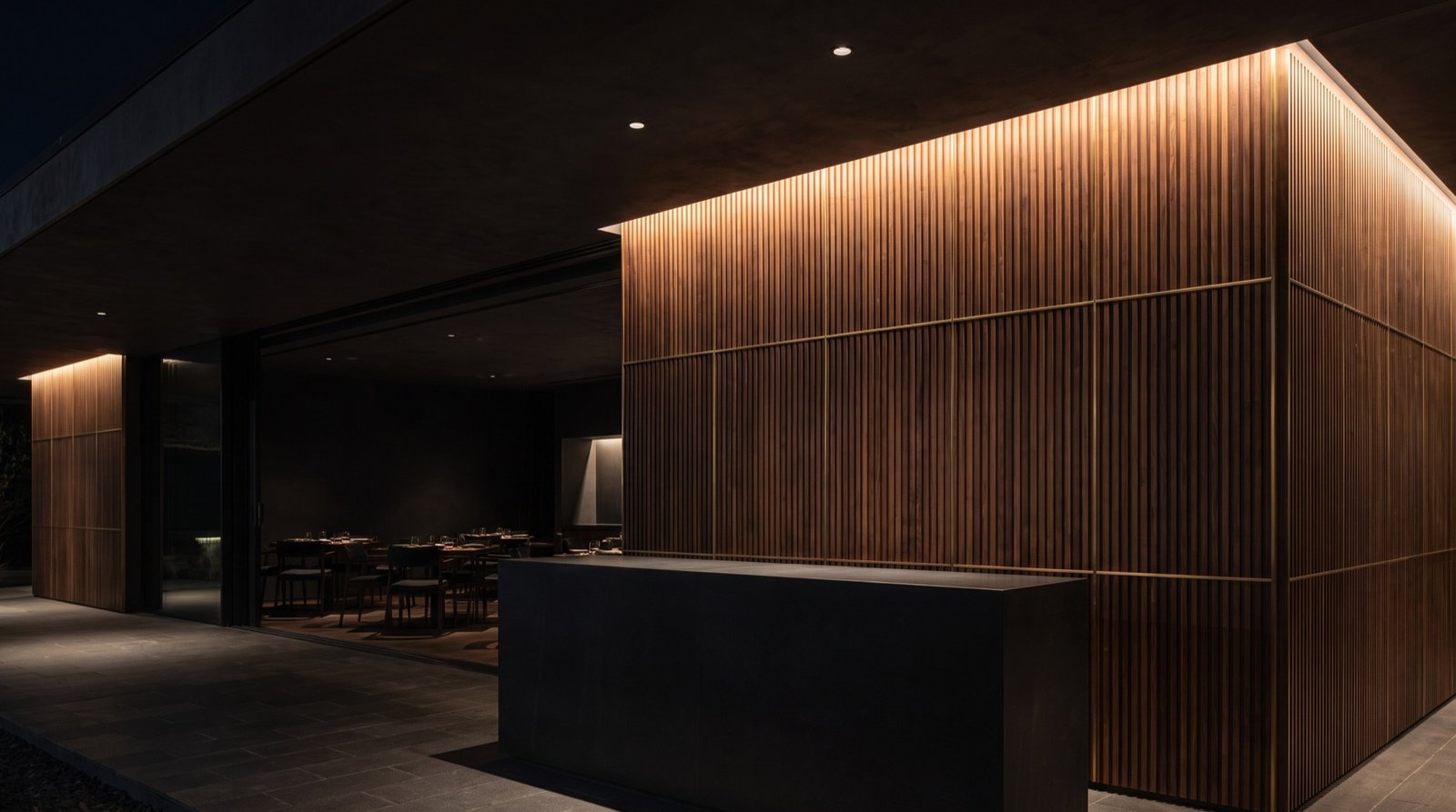 Restaurant host area with a walnut slat feature wall and a brushed bronze inlay grid