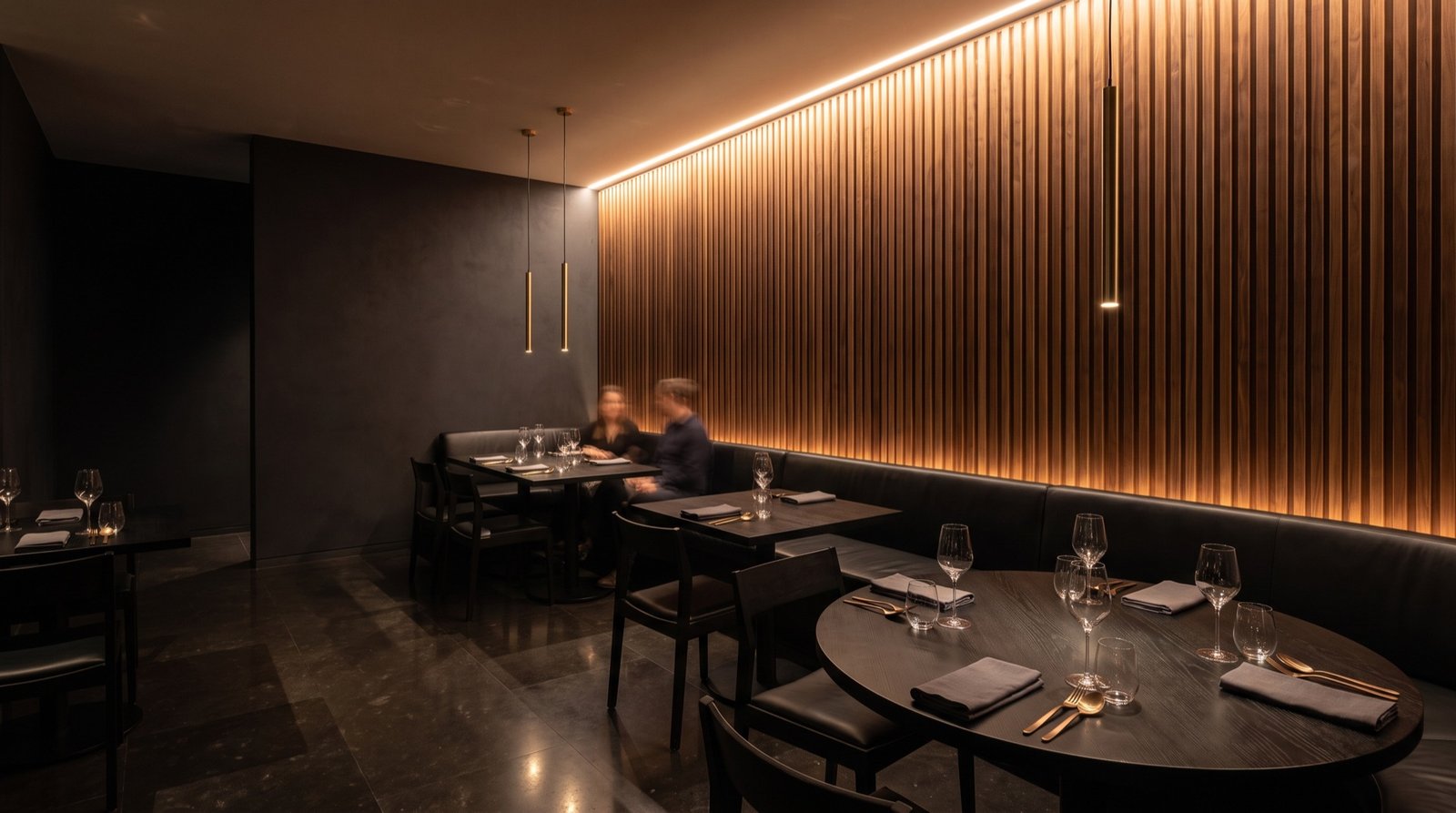 Dining room after: walnut slat feature wall with integrated cove lighting